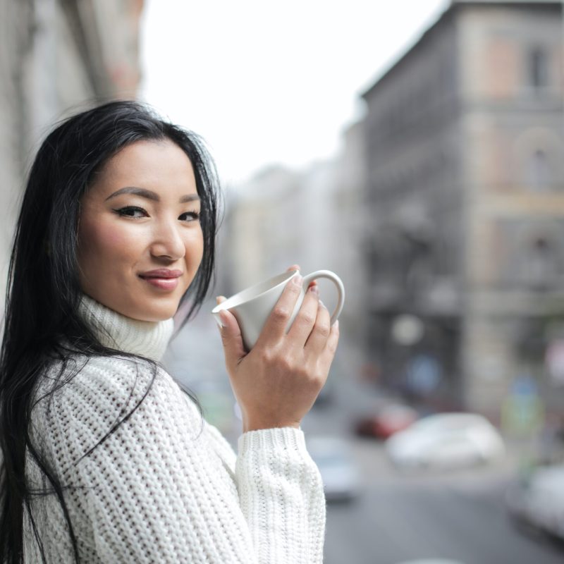 selective-focus-photo-of-woman-in-white-knit-sweater-holding-3764159